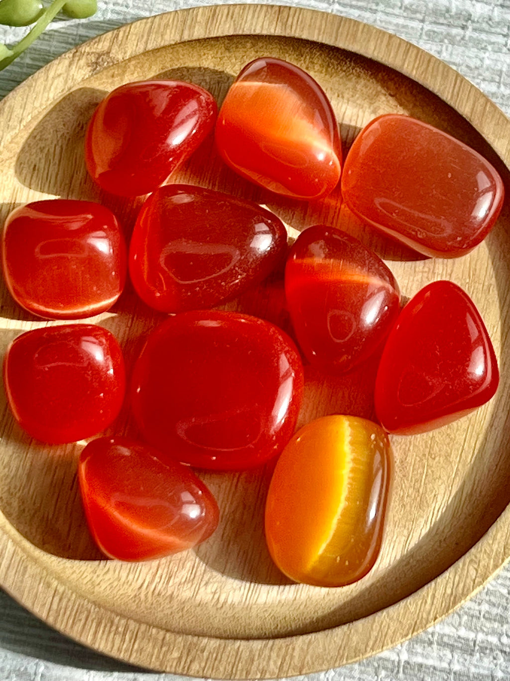 Red Cats Eye tumblestone crystal, gemstone gift for her, Cat’s Eye, wealth & protection, ethically sourced UK healing crystals, Root Chakra